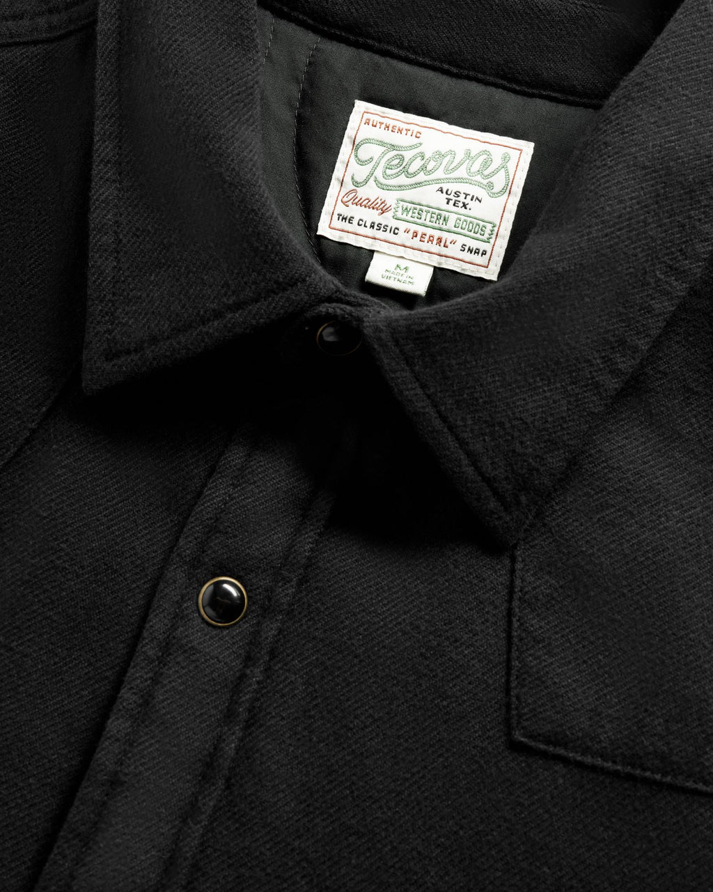 Closeup detail view of Men's Sawtooth Pearl Snap Shacket - Black