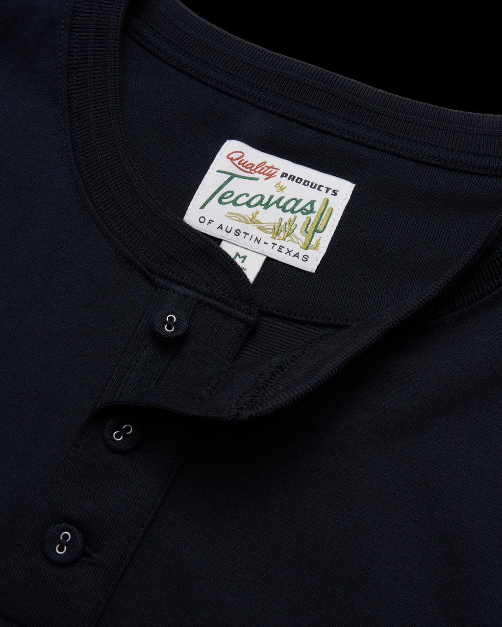 closeup of the men's black short sleeve henley