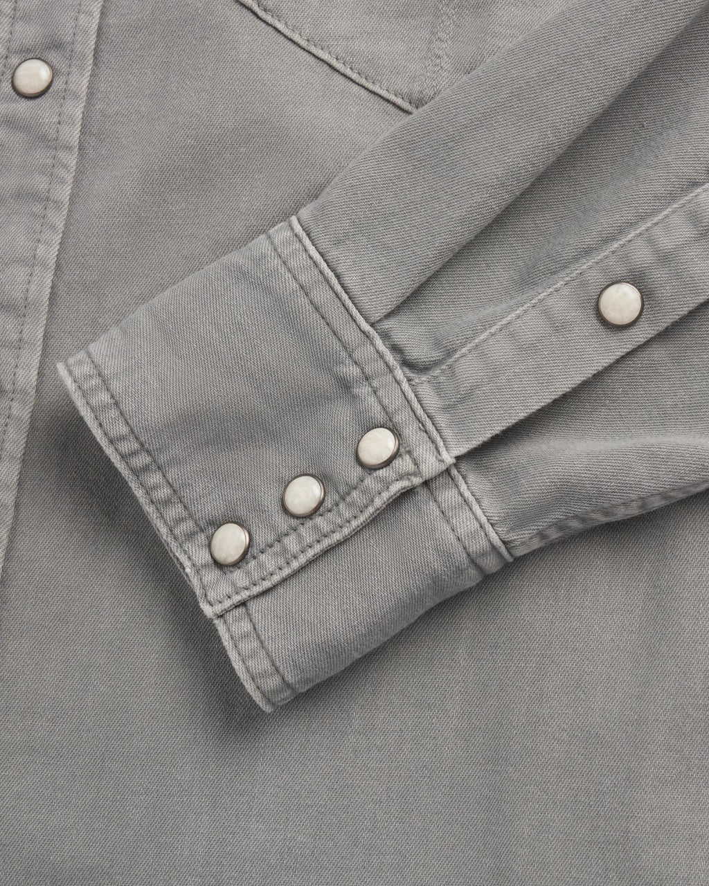 Closeup detail view of Men's Denim Pearl Snap - Light Gray