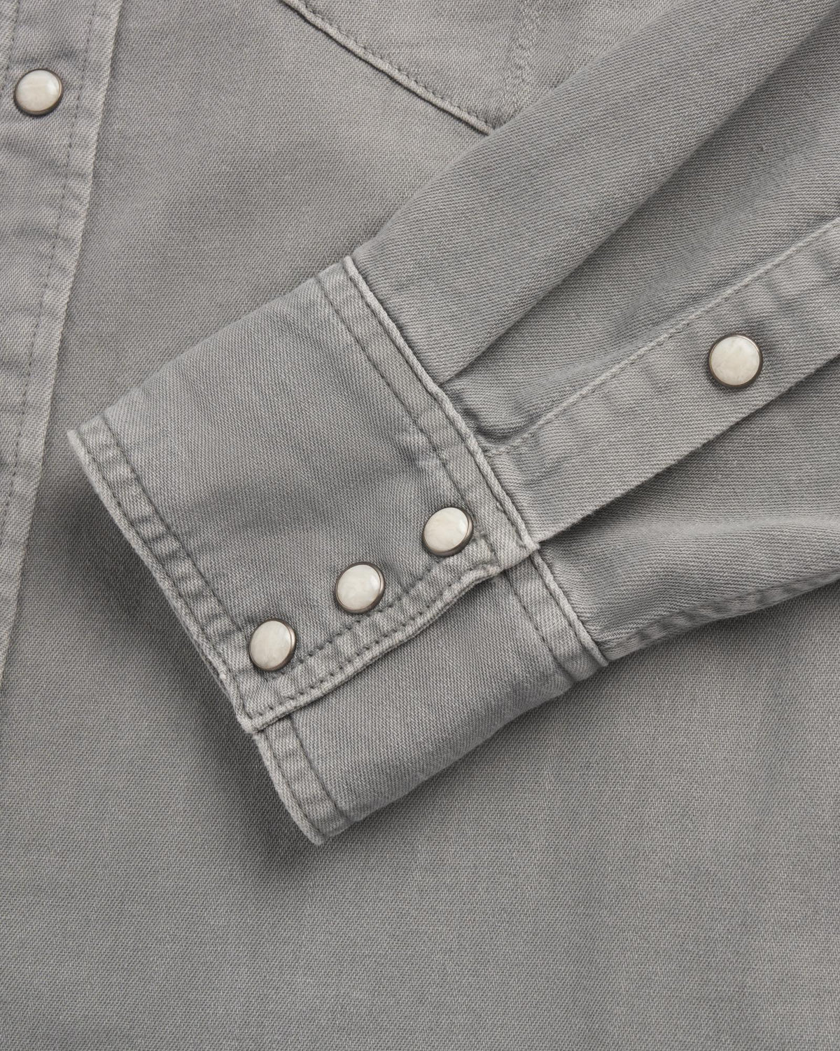Closeup detail view of Men's Denim Pearl Snap - Light Gray