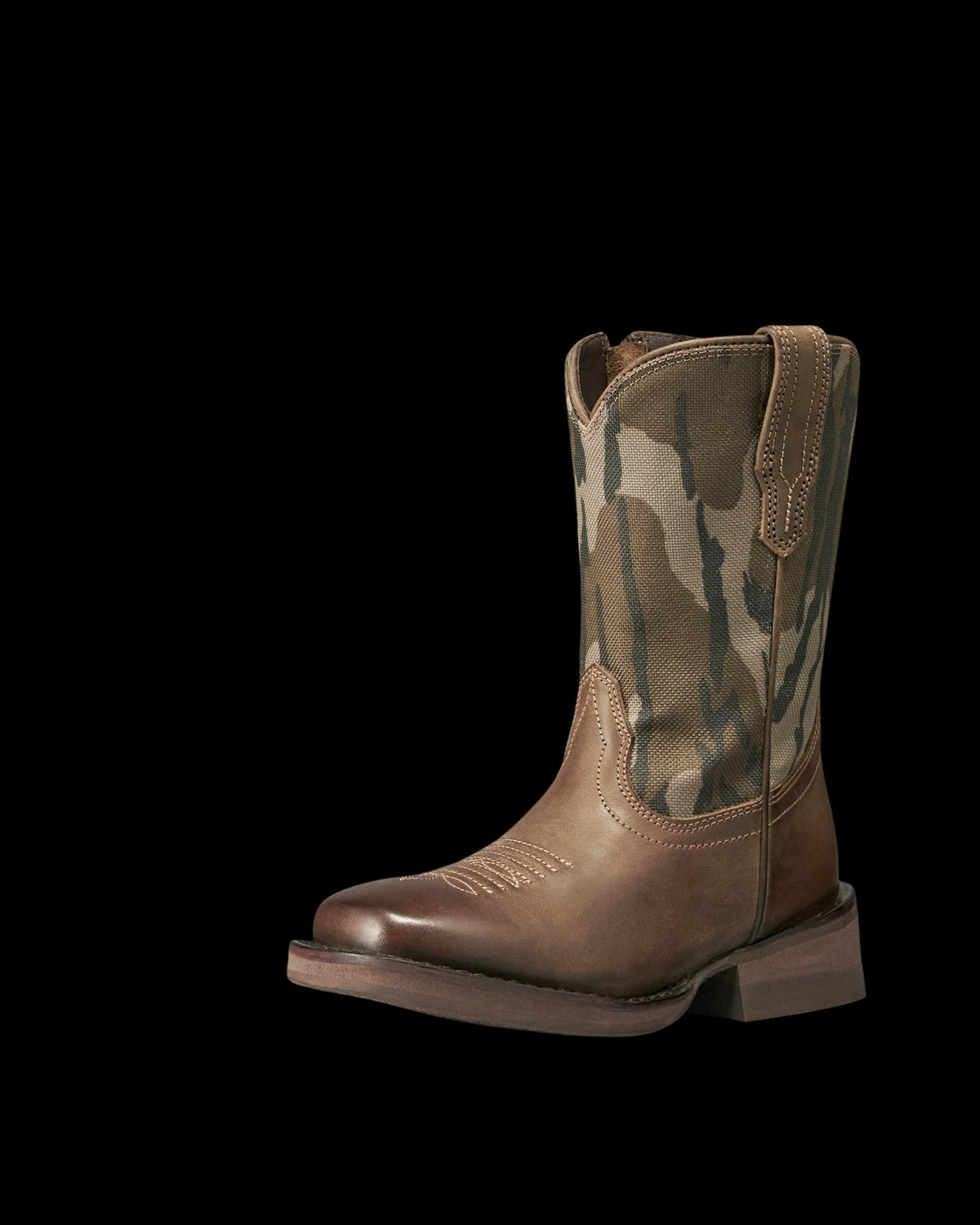 Brown leather cowboy boot with a camo fabric shaft, sturdy heel, and pull tabs, displayed on a plain white background.