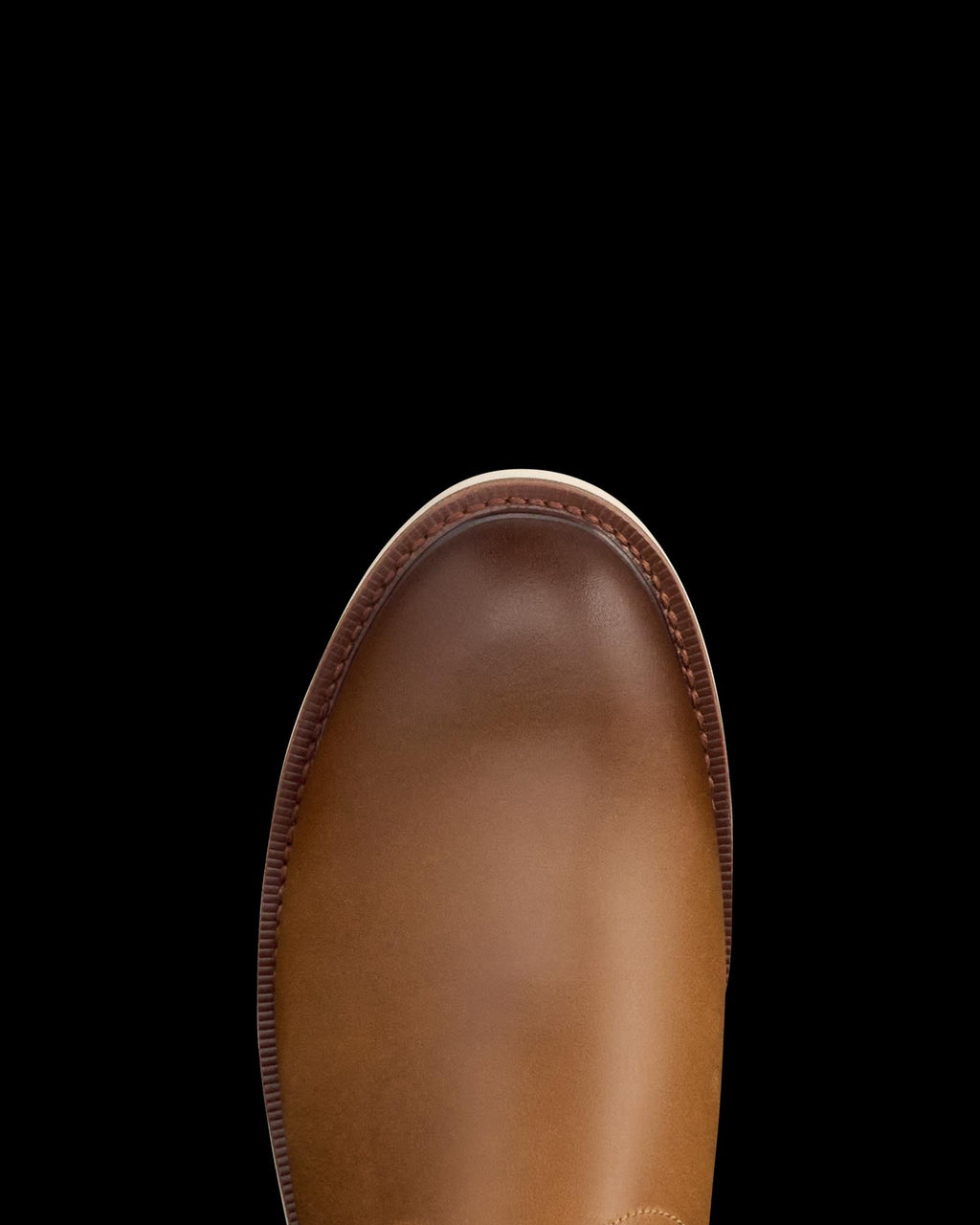 The Knox in Wheat Cowhide. Top view of the toe of a wheat cowhide leather boot against a white background.
