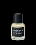 A clear glass bottle of Ranger Station Waterloo eau de parfum with a black cap and a black label featuring white text.