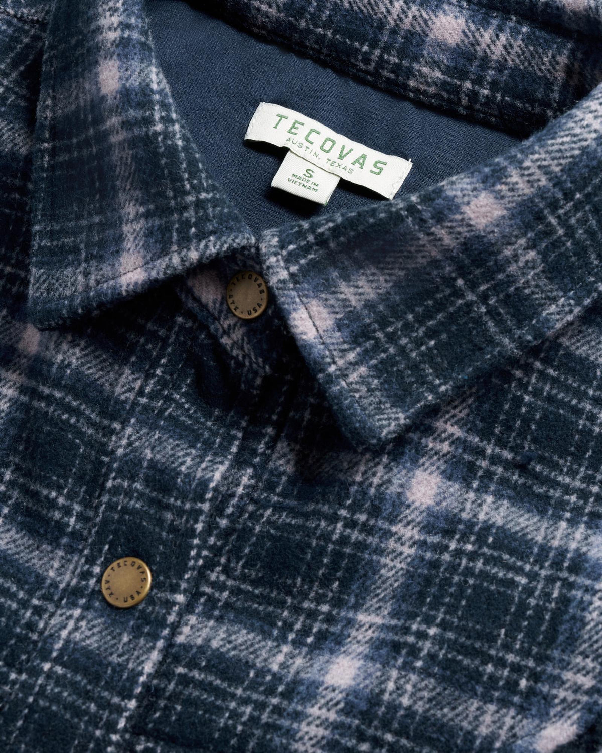 Closeup detail view of Women's Plaid Fringe Shacket - Navy / Mauve