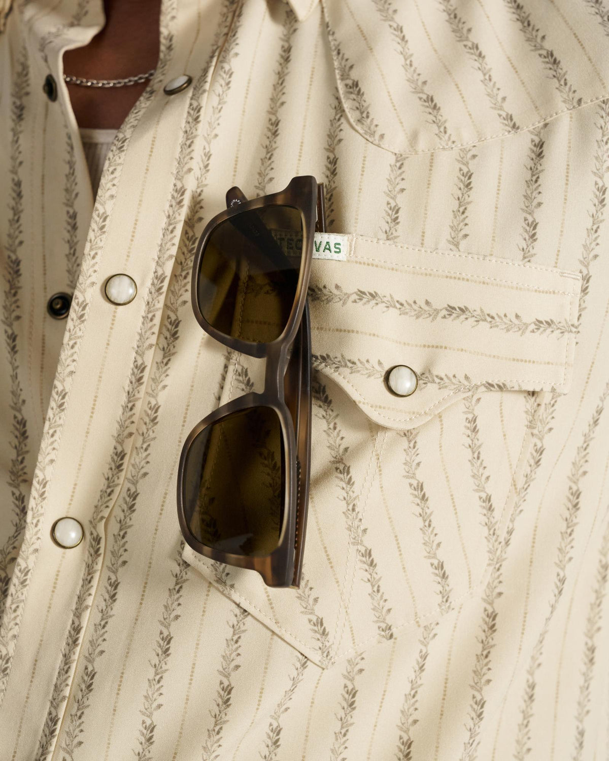 Closeup detail view of Men's Performance Western Short Sleeve Pearl Snap - Sandstone/Multi