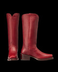 The Charlie in Scarlet Cowhide. Pair of tall, scarlet cowhide leather boots with block heels and a square toe, shown front and side view against a white background.