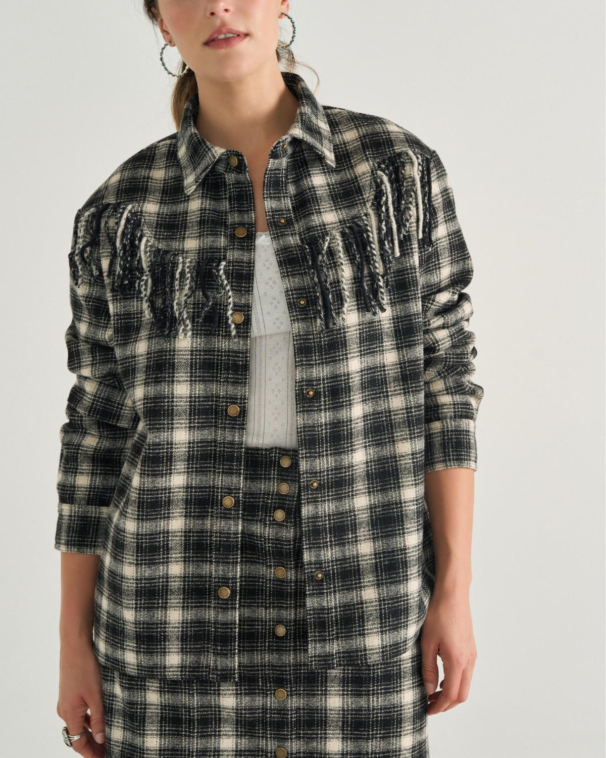 Closeup detail view of Women's Plaid Fringe Shacket - Black / White