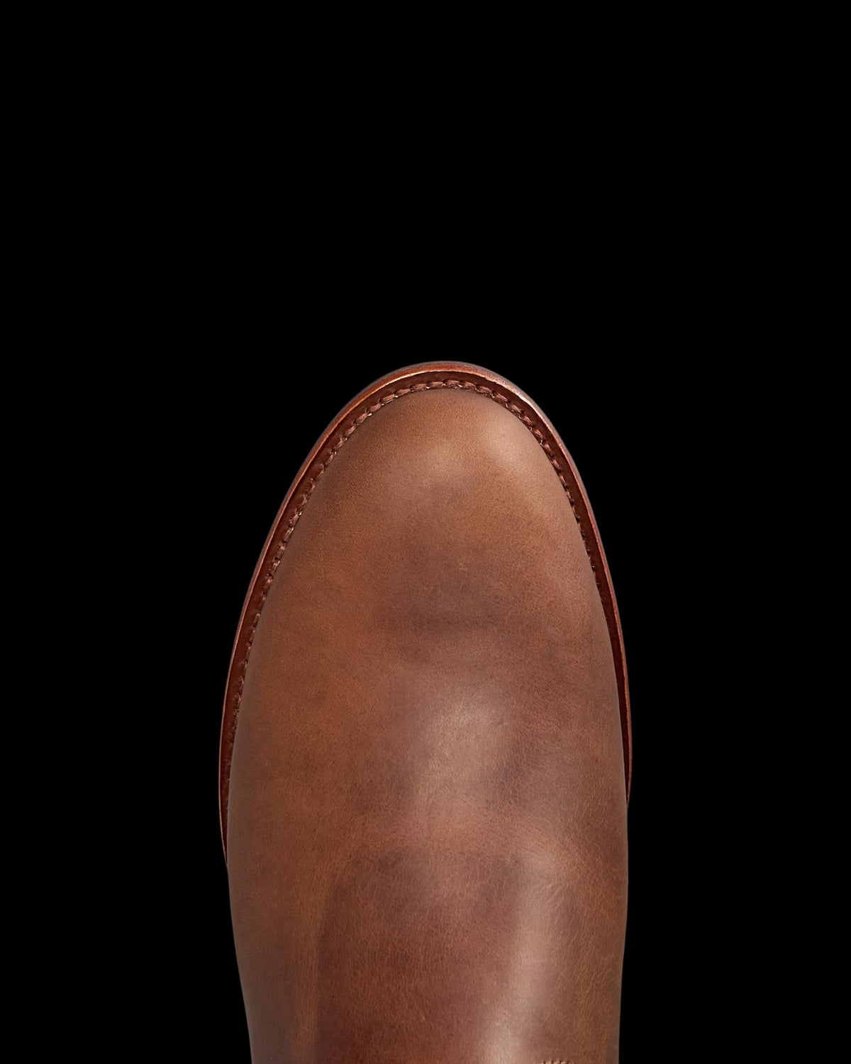 Toe view of The Glen - Light Molasses Cowhide on plain background
