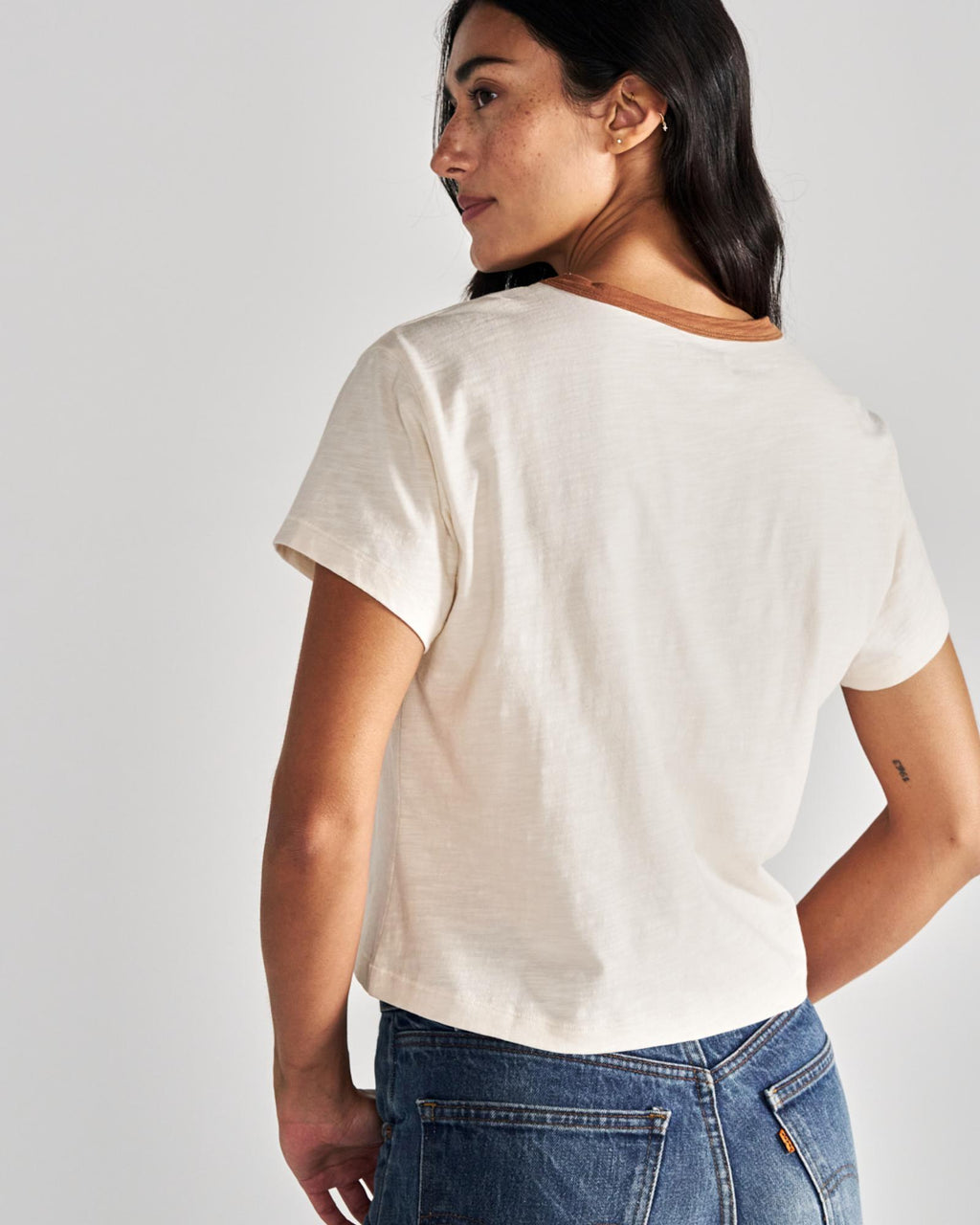 Back view of Women's Vintage Ringer Tee - Cream/Tan on model