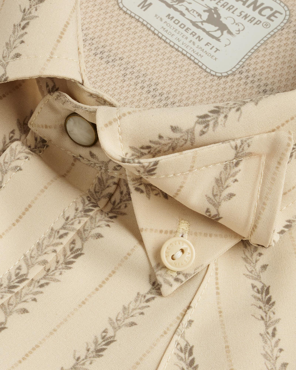 Closeup detail view of Men's Performance Western Short Sleeve Pearl Snap - Sandstone/Multi