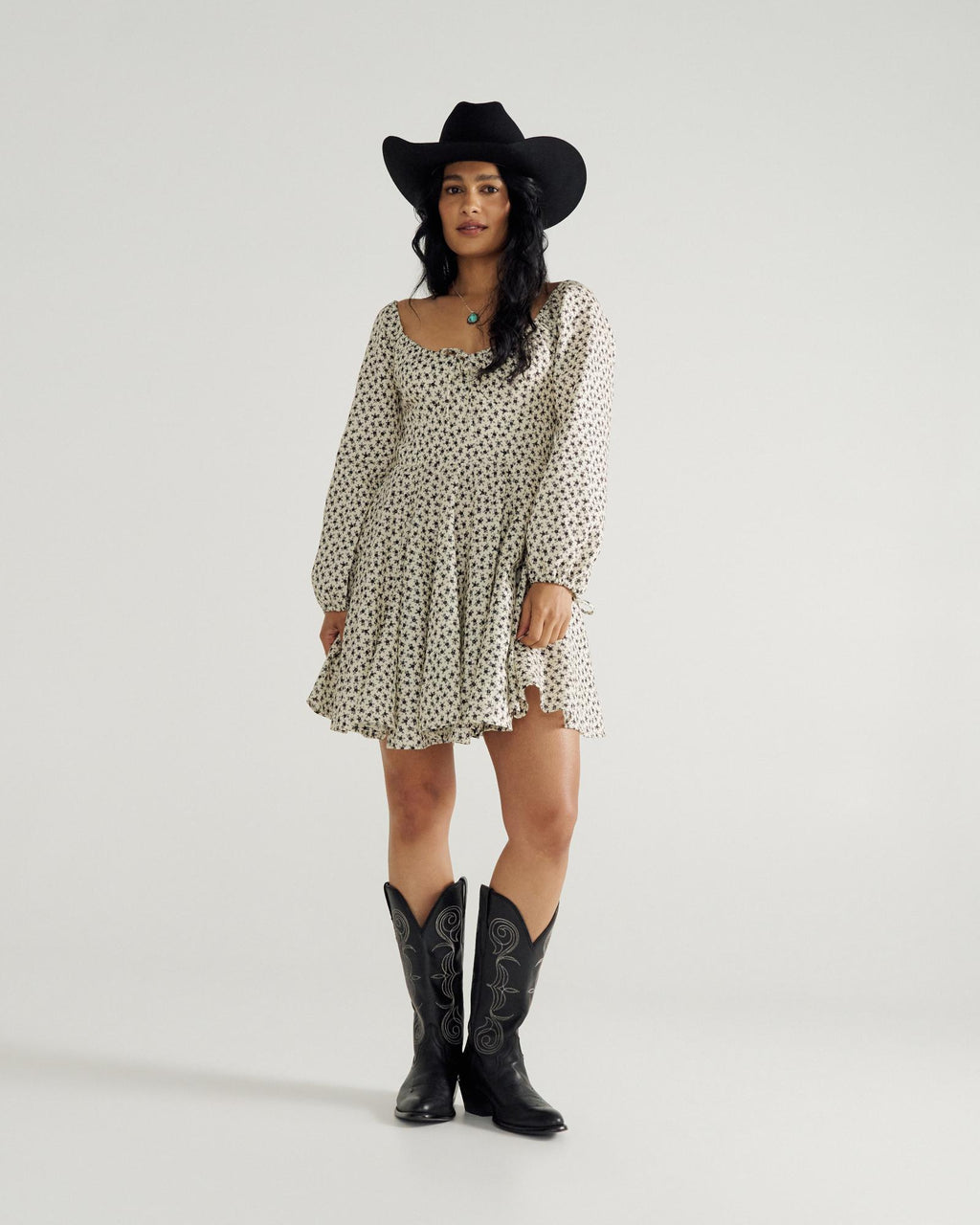 Full view of Women's L/S Mini Dress - Cream / Black on model