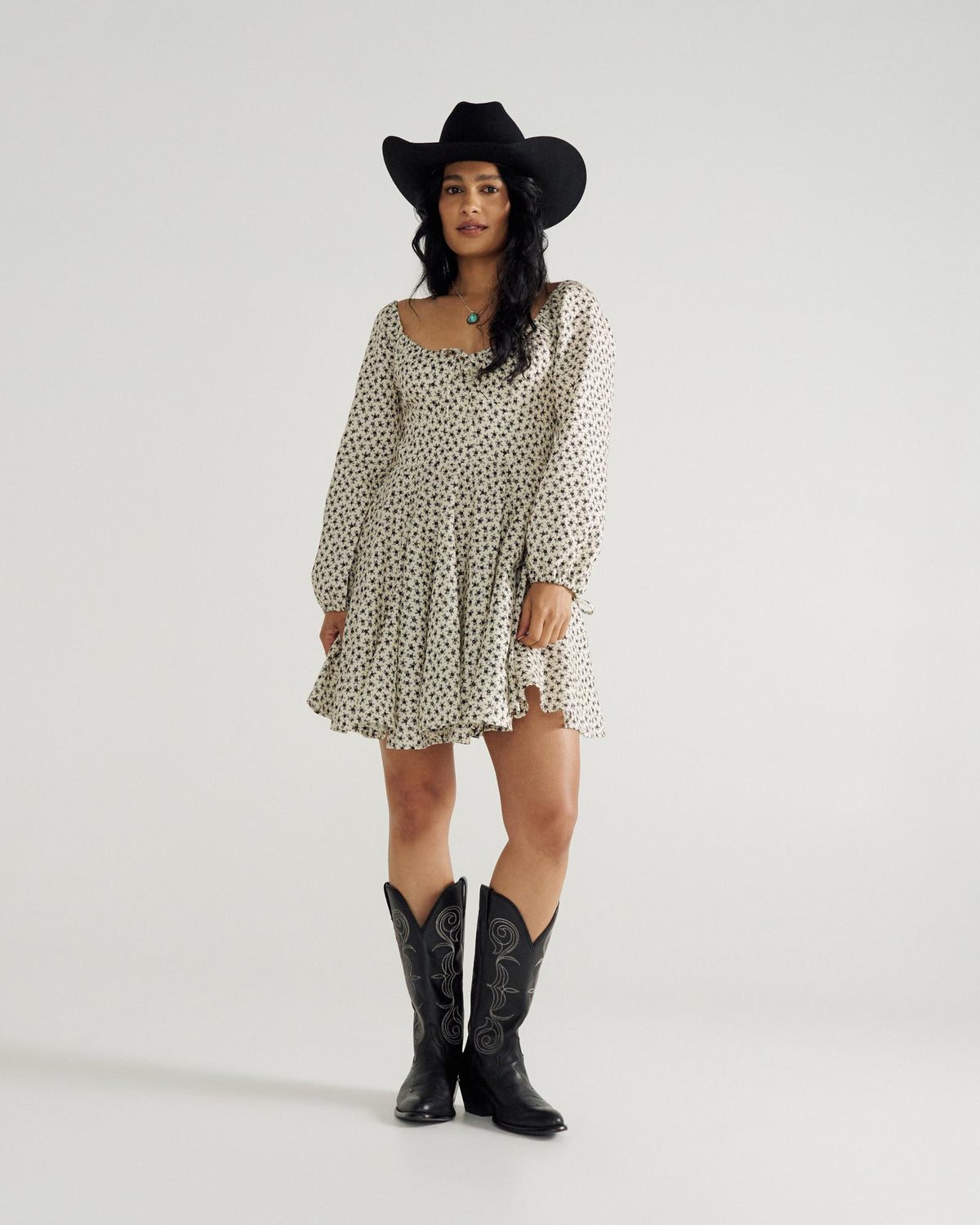 Full view of Women's L/S Mini Dress - Cream / Black on model
