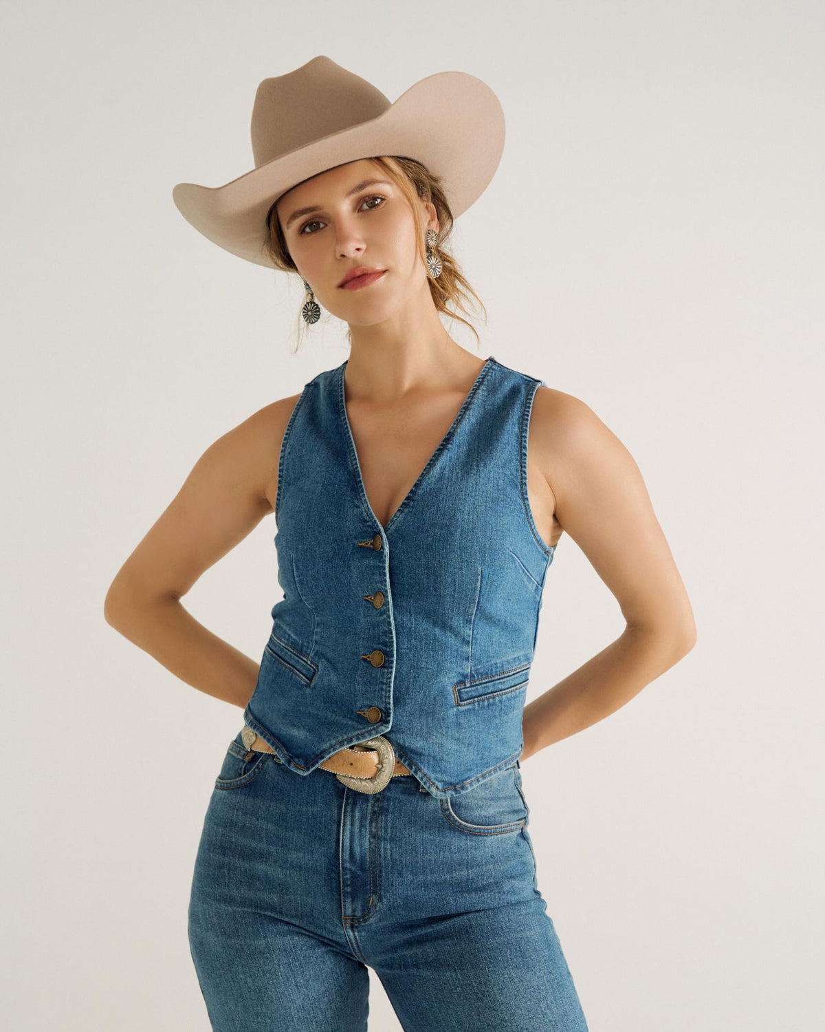 Front view of Women's Denim Vest - Medium Wash on model