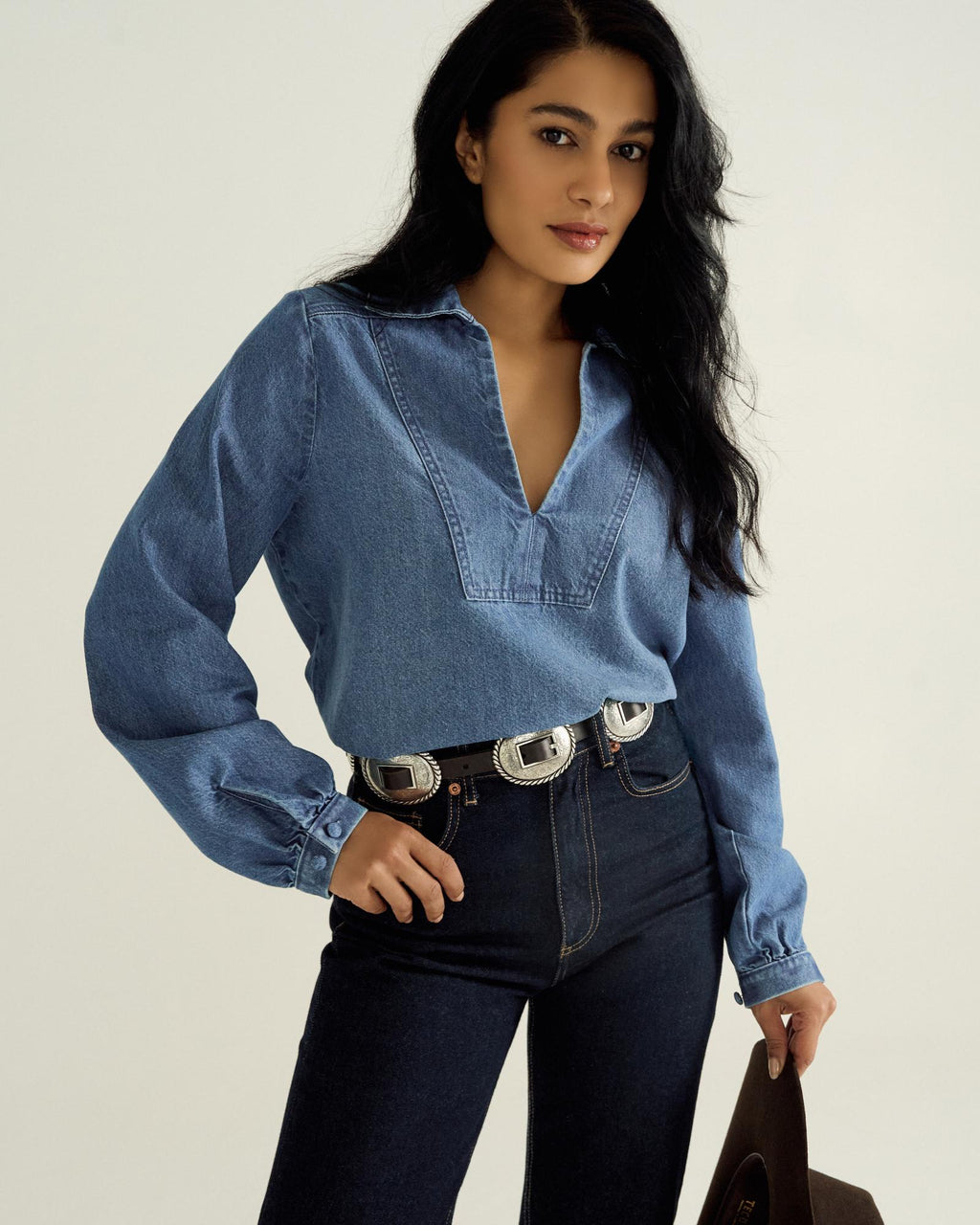 Front view of Women's L/S Denim Popover Top - Medium Wash on model