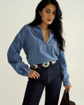 Front view of Women's L/S Denim Popover Top - Medium Wash on model