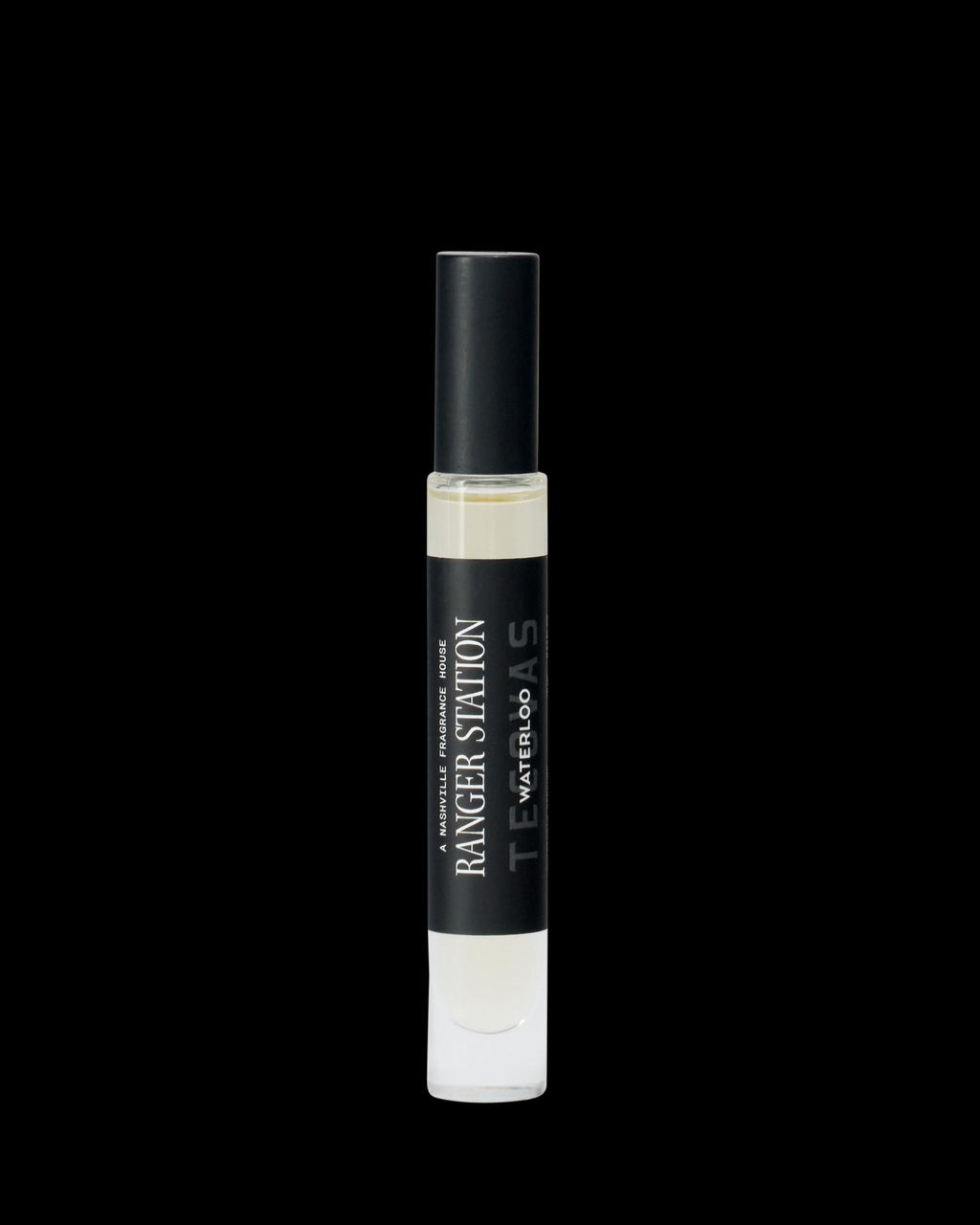A clear glass perfume spray bottle labeled "Ranger Station Teakwood & Water" with a black cap, shown on a plain white background.