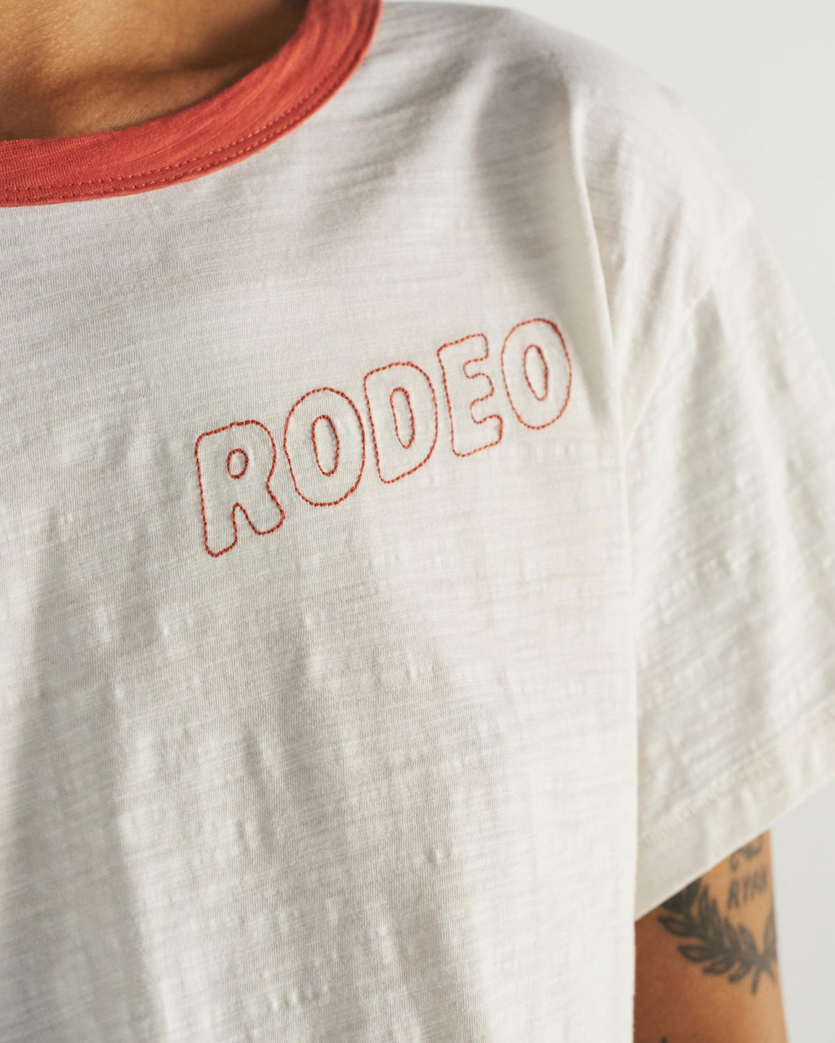 Closeup detail view of Women's Vintage Ringer Tee - Bone/Ginger Spice