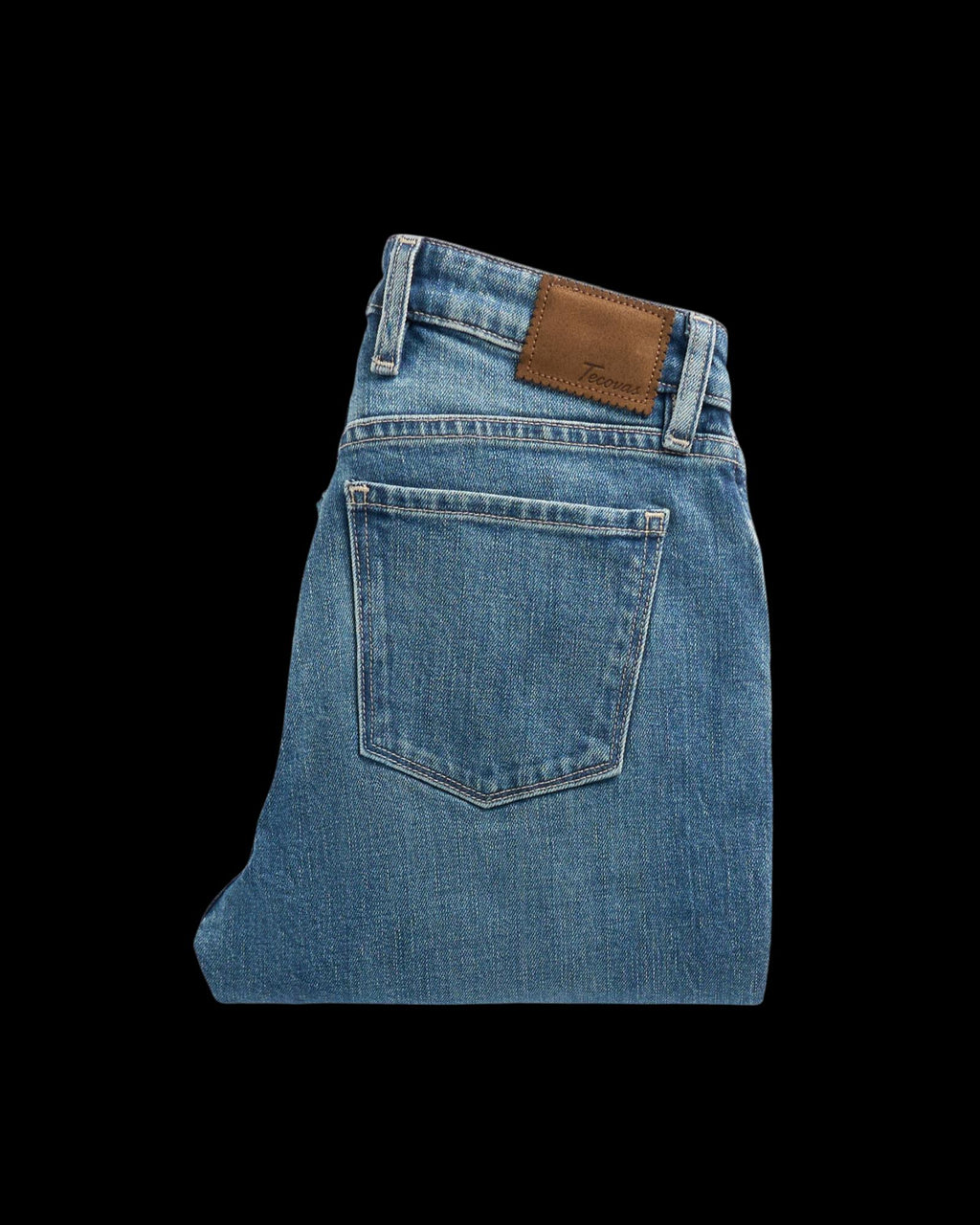 Folded view of Women's Mid-Rise Slim Flare - Medium Wash on plain background