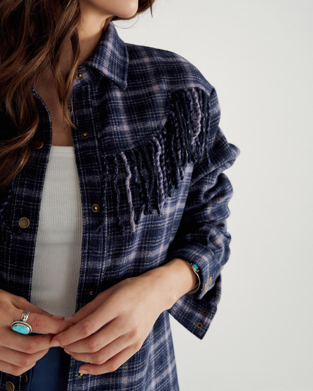 Closeup detail view of Women's Plaid Fringe Shacket - Navy / Mauve