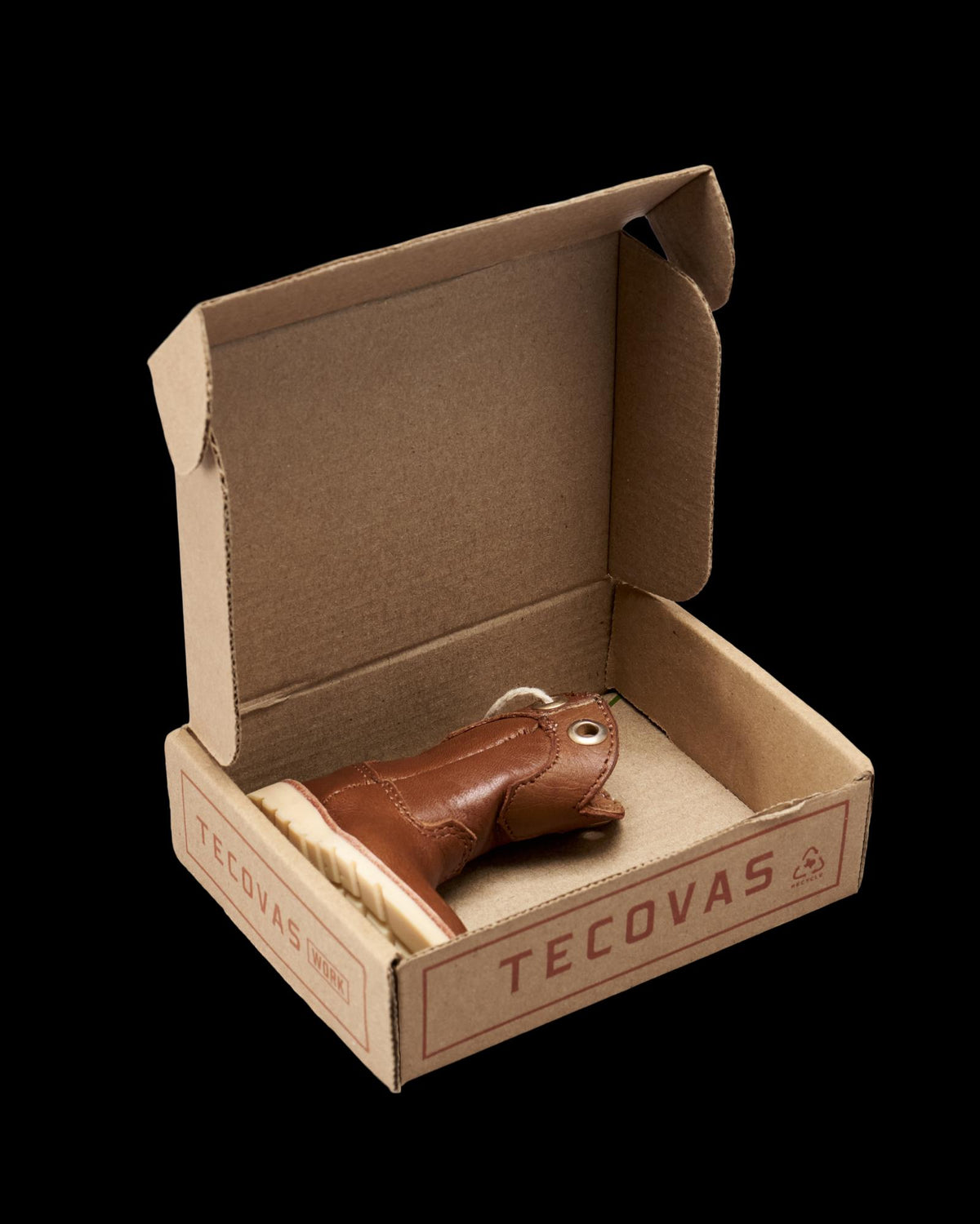 Inside view of LongHaul Roper Work Boot Ornament - Saddle on plain background