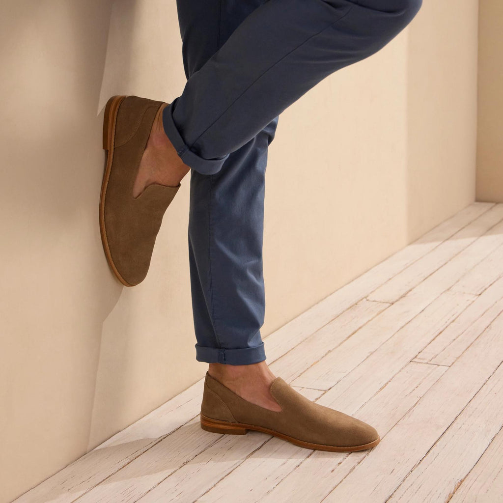 man wearing a granite grey suede slip on shoe
