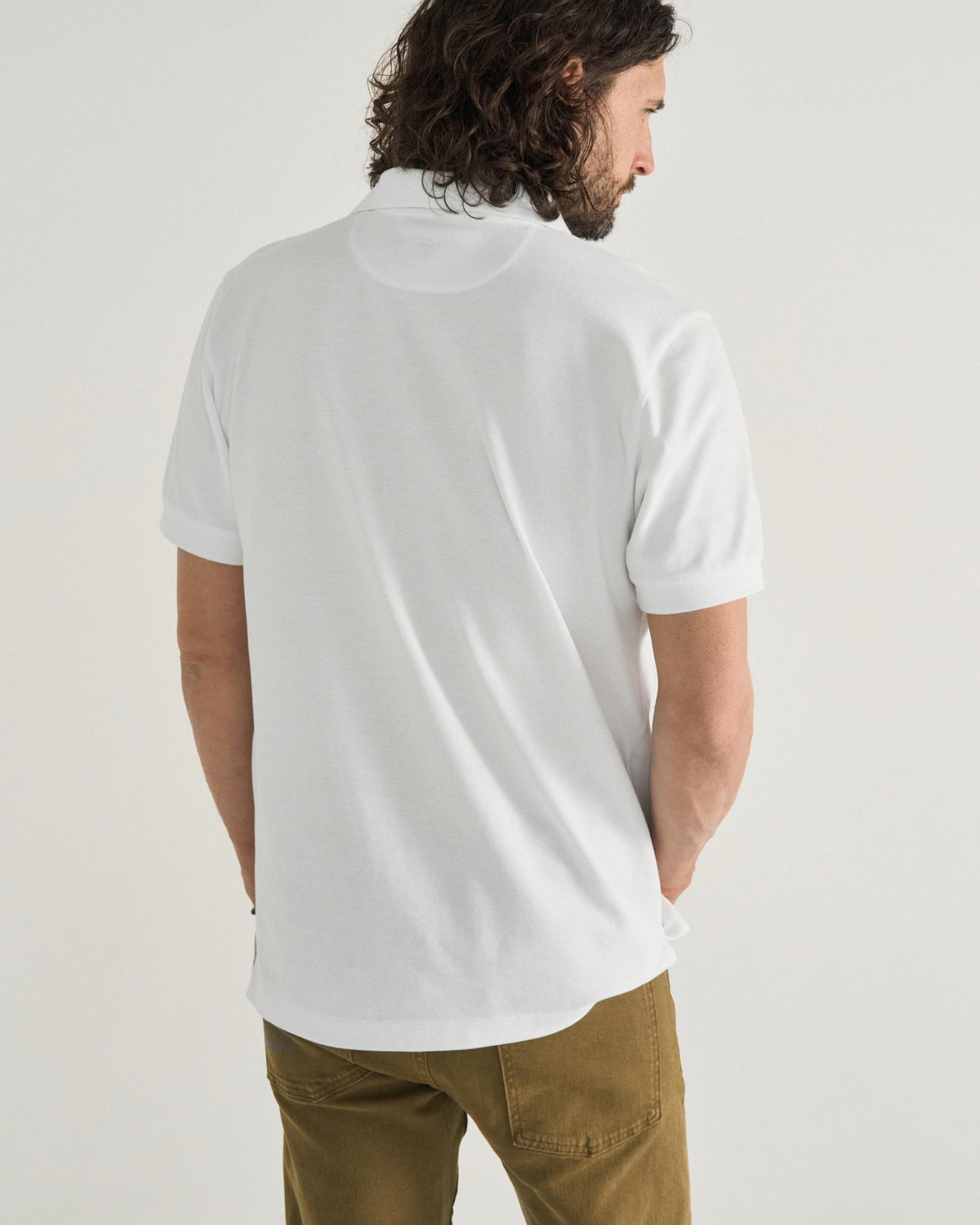 Closeup detail view of Men's Polo Pearl Snap SS - White
