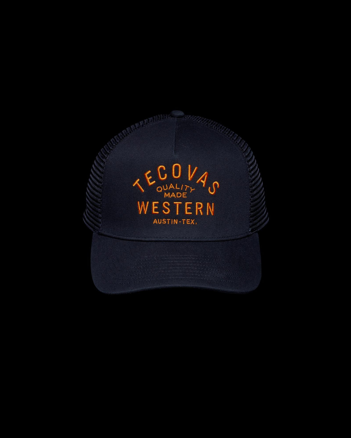 Front view of Quality Made Trucker Hat - Black/Orange on plain background