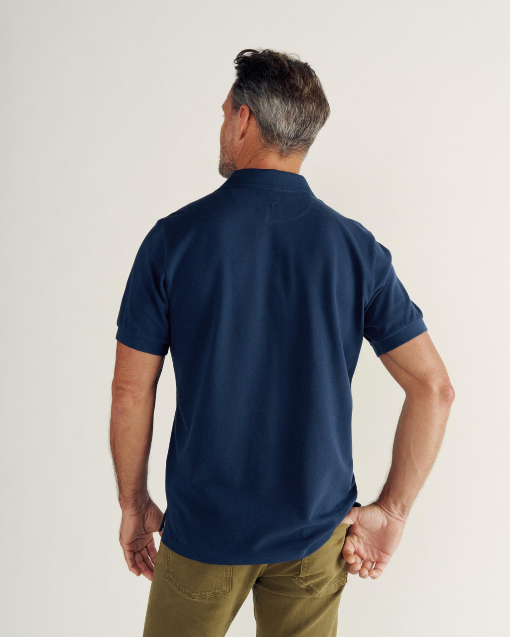 Closeup detail view of Men's Polo Pearl Snap SS - Navy
