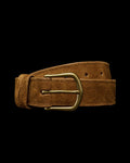 A brown suede belt with a brass buckle is coiled against a plain white background.