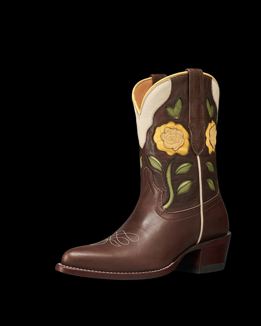 Truffle brown leather cowboy boot with yellow floral embroidery, green leaves, cream trim, and a stacked heel—The Jolene Cowhide—shown on a white background.