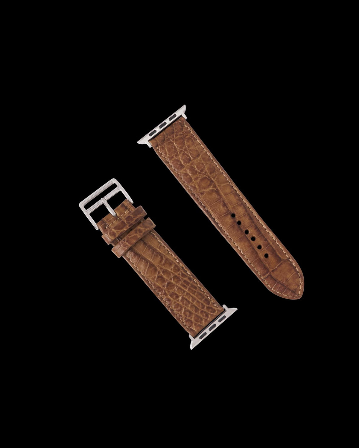 Brown crocodile-pattern leather watch band with silver hardware, displayed in two separate pieces on a white background.