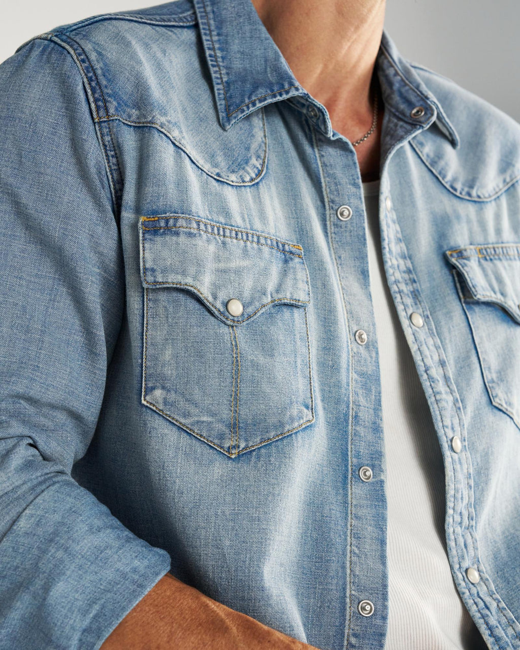 Closeup detail view of Men's Denim Pearl Snap LS - Light Wash
