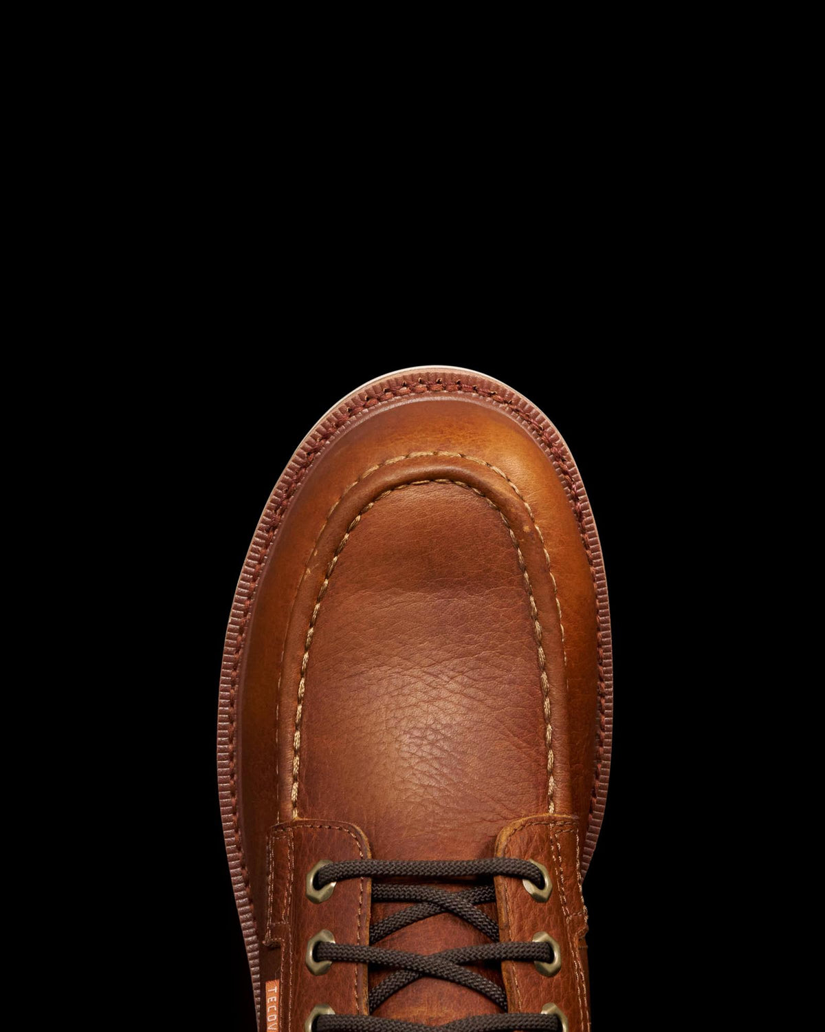 Toe view of The LH WP Moc Comp Toe Work Boot - Saddle Cowhide on plain background