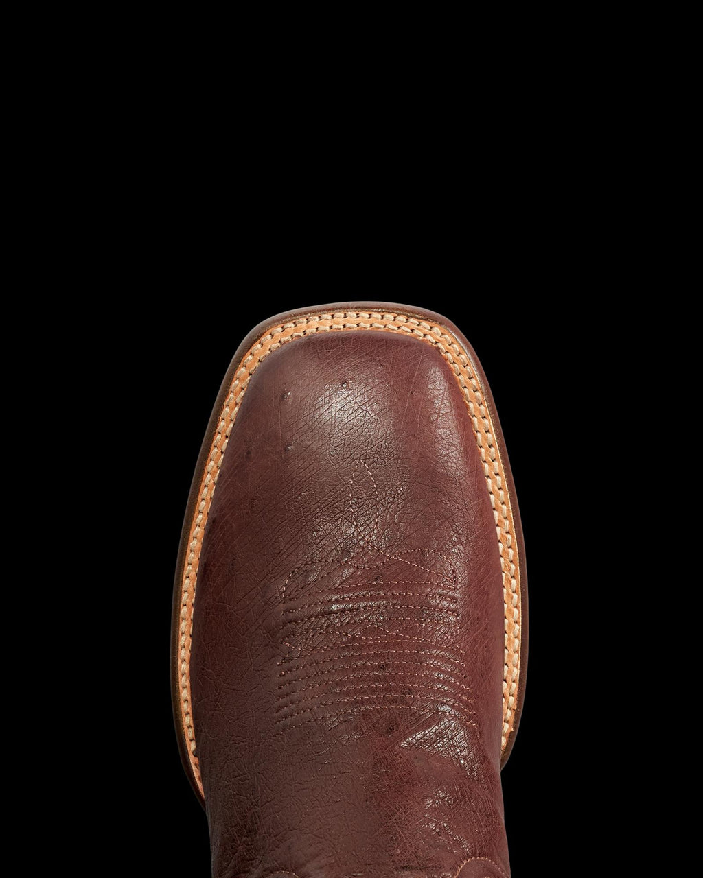 Toe view of The Cody - Mahogany Smooth Ostrich on plain background
