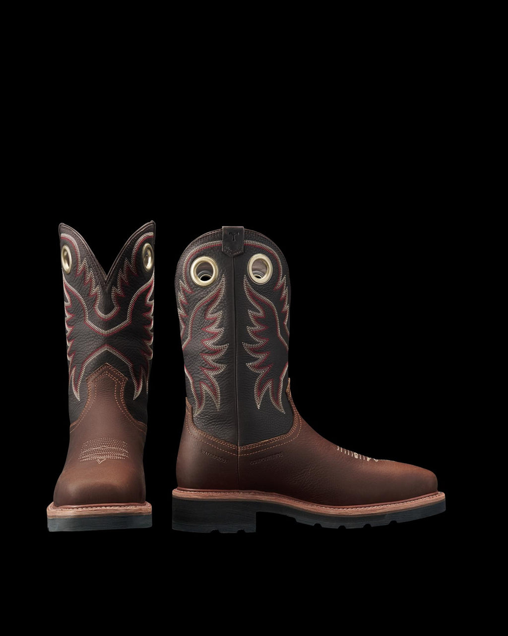 LongHaul Waterproof Square Composite Toe Work Boot in Tobacco / Black Cowhide. A pair of Tobacco / Black cowhide cowboy boots with decorative red and white stitching and pull holes, shown from the front and side.