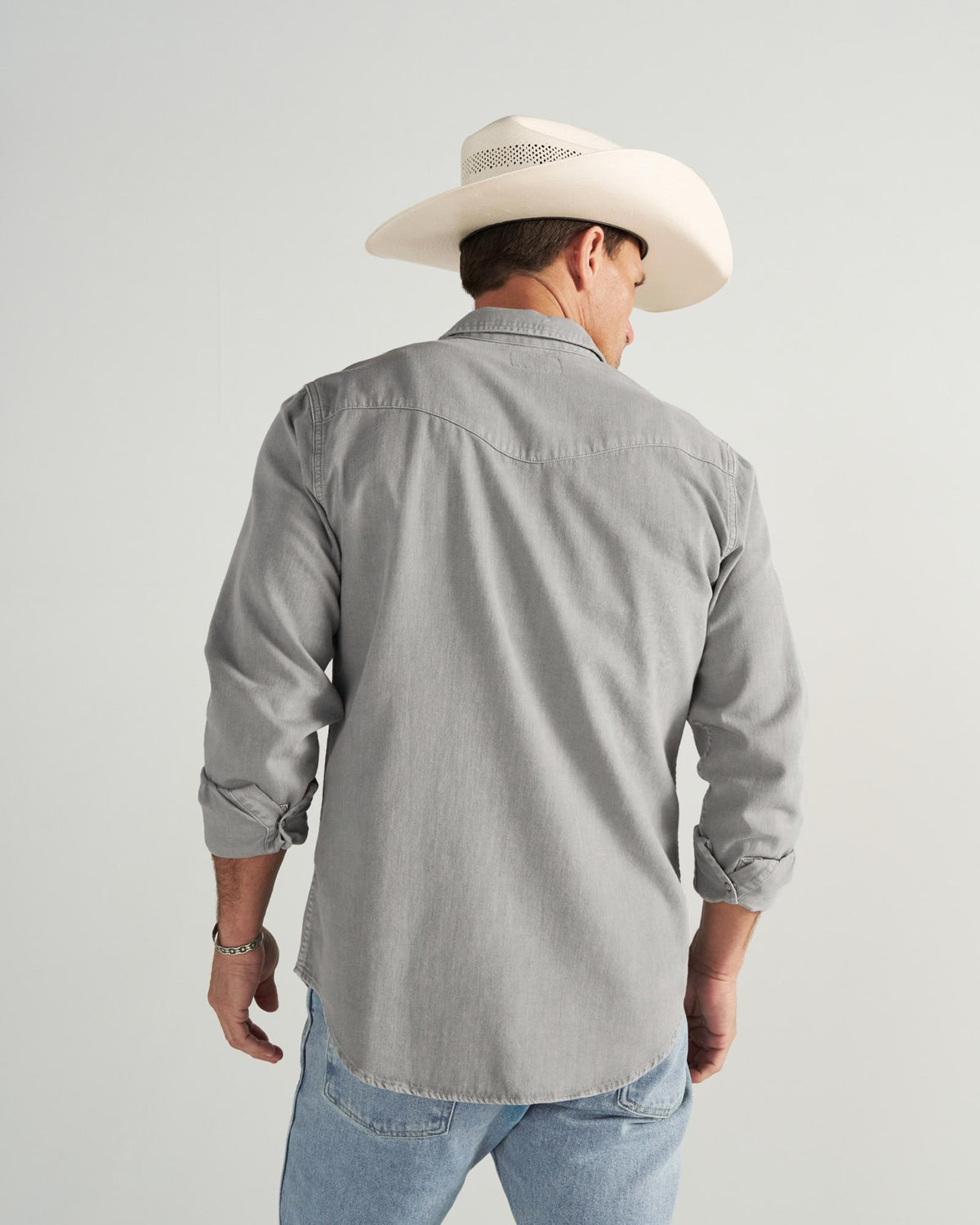 Closeup detail view of Men's Denim Pearl Snap - Light Gray
