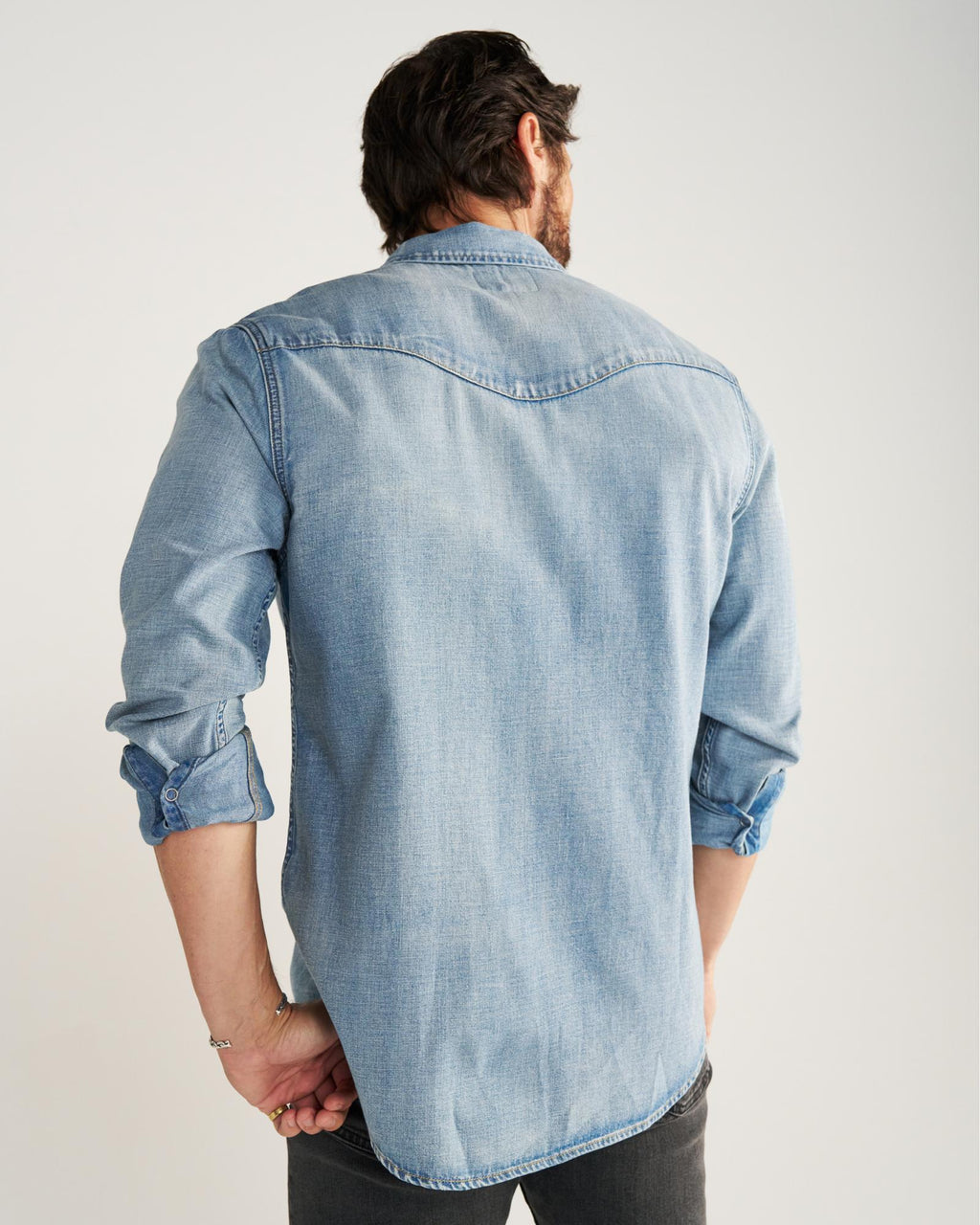 Closeup detail view of Men's Denim Pearl Snap LS - Light Wash