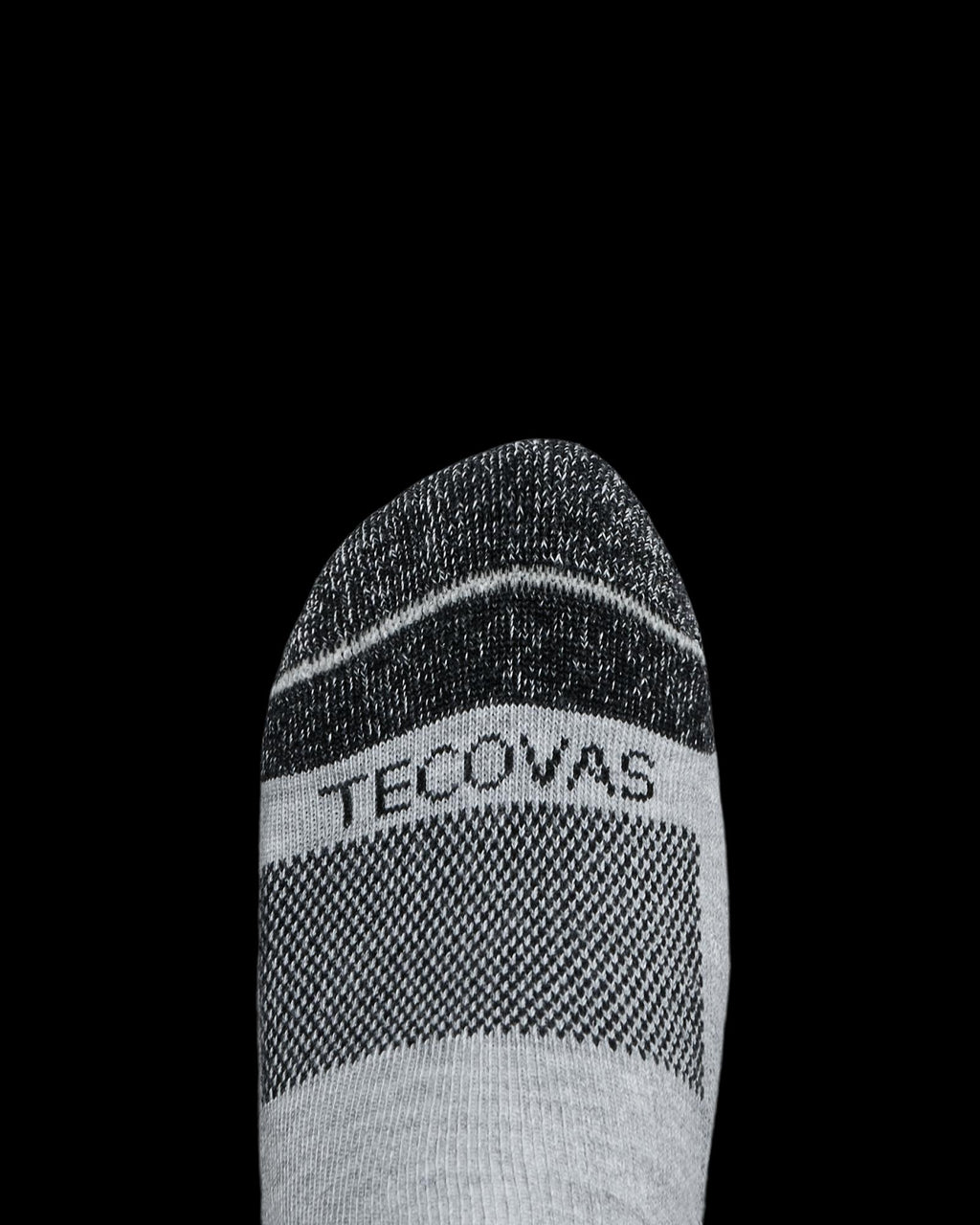 Gray and black sock with the word "Tecovas" on the toe, shown against a plain white background.