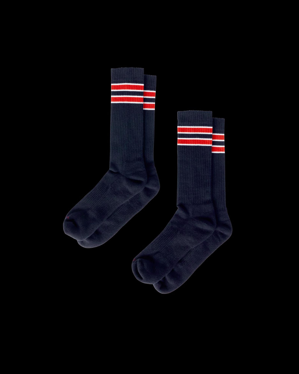 Quarterfront view of Mid-Calf Performance Socks (2-Pack) - Navy / Red on plain background