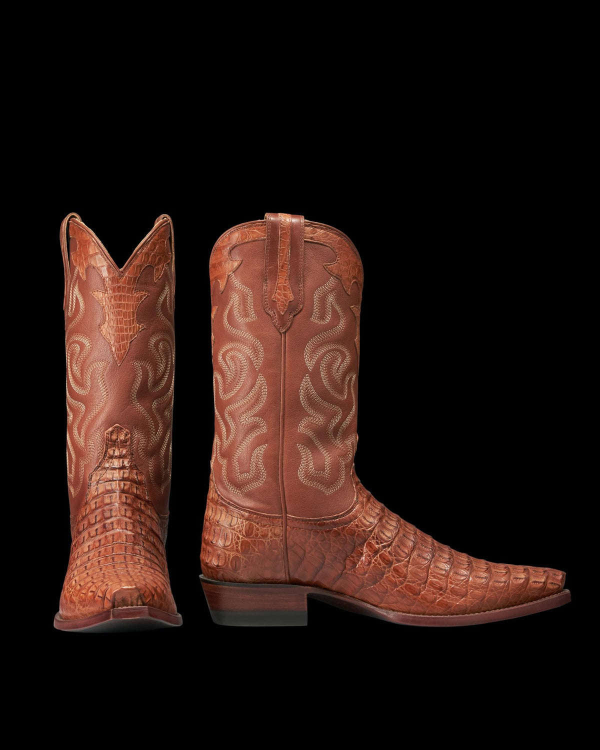 A pair of The Garrett Hornback Caiman cowboy boots in rich pecan brown, featuring textured, patterned hornback caiman leather and decorative stitching on the shafts, shown side by side on a white background.