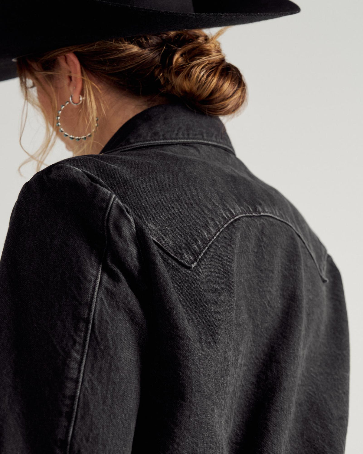 Back view of Women's Rodeo Concho Denim Jacket - Black on model