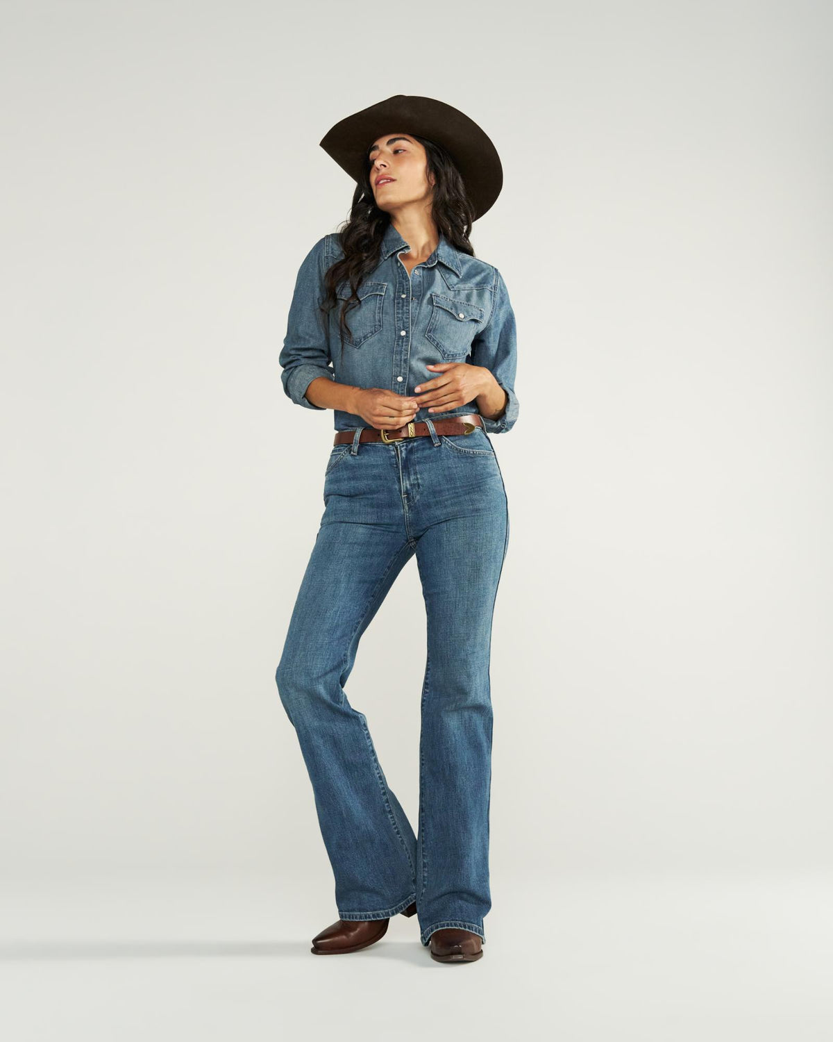 Full view of Women's Mid-Rise Slim Flare - Medium Wash on model