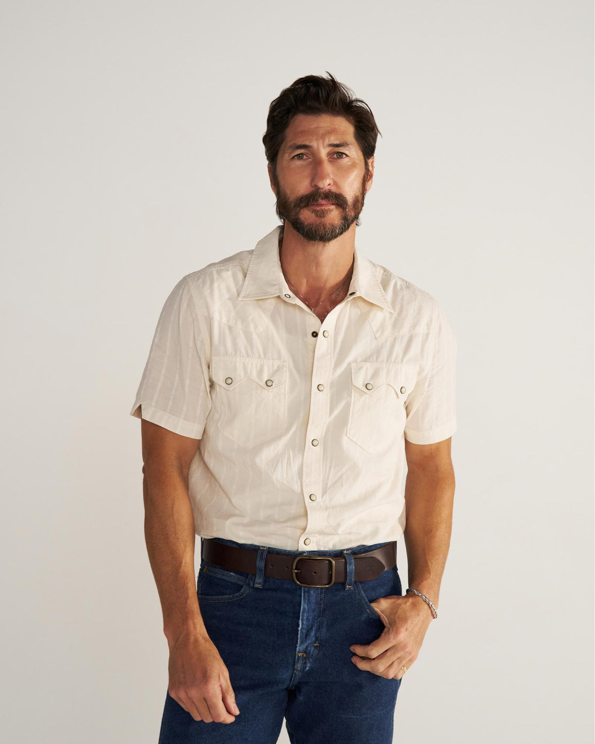 Closeup detail view of Men's Vintage Weight Short Sleeve Pearl Snap - Light Sand/Multi