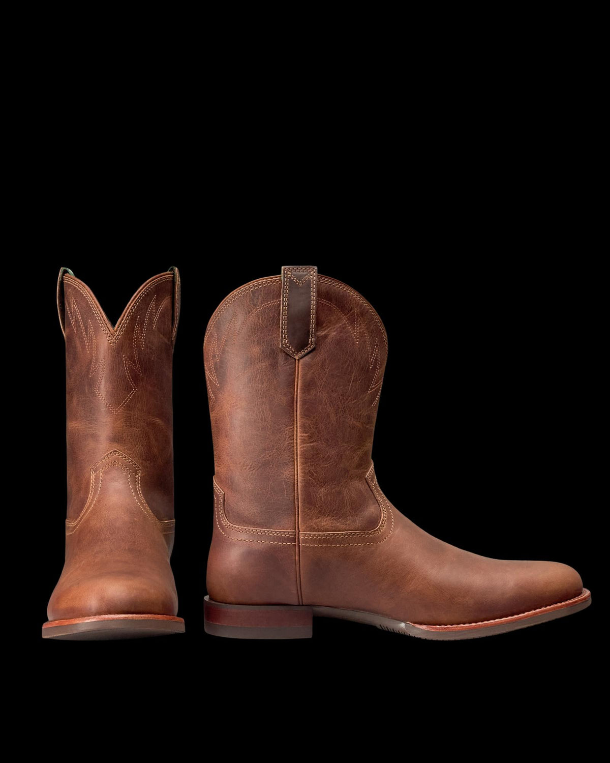 Pair view of The Glen - Light Molasses Cowhide on plain background