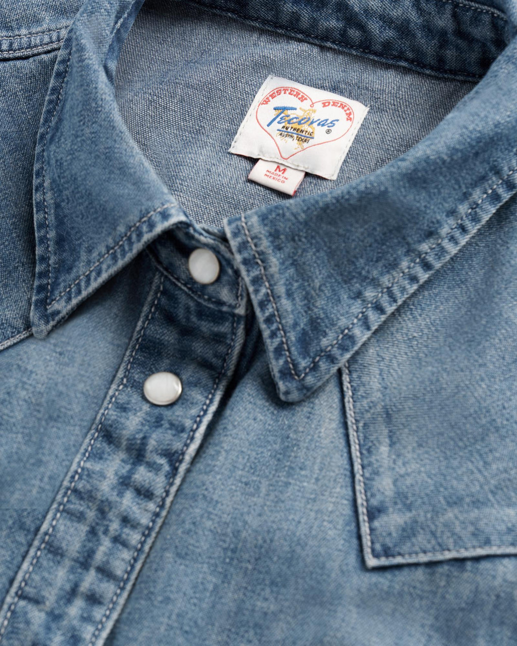 Closeup detail view of Women's Denim Pearl Snap (III) - Medium Wash