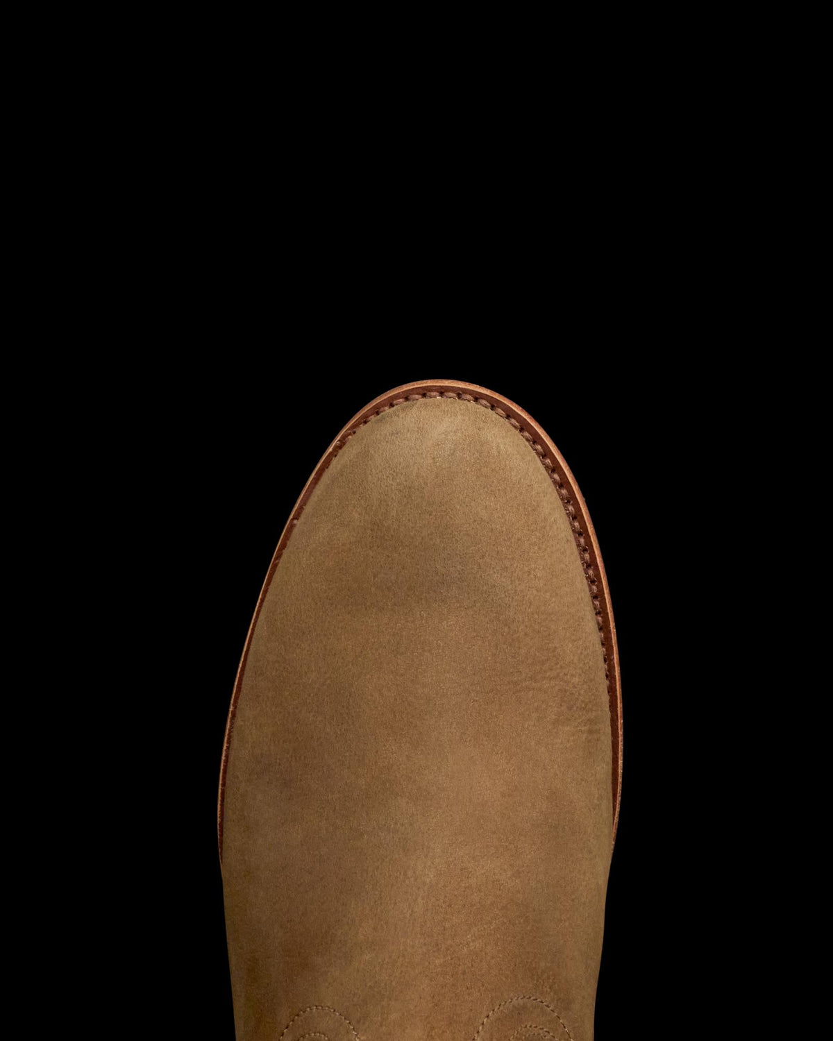 Toe view of The Glen - Light Mesquite Cowhide on plain background