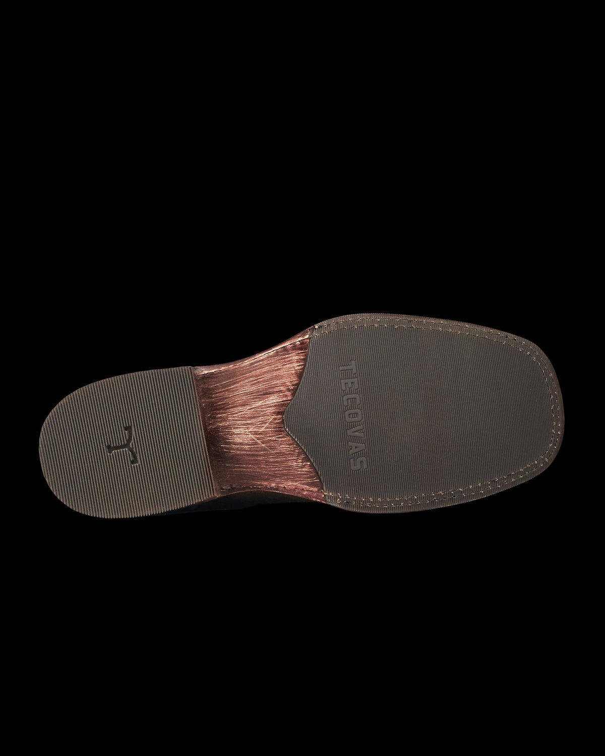The image shows the bottom view of a brown dress shoe sole with a textured rubber heel and toe, and the word "GEORGES" embossed in the center, reminiscent of refined designs like The Doc Suede or Moss Suede.