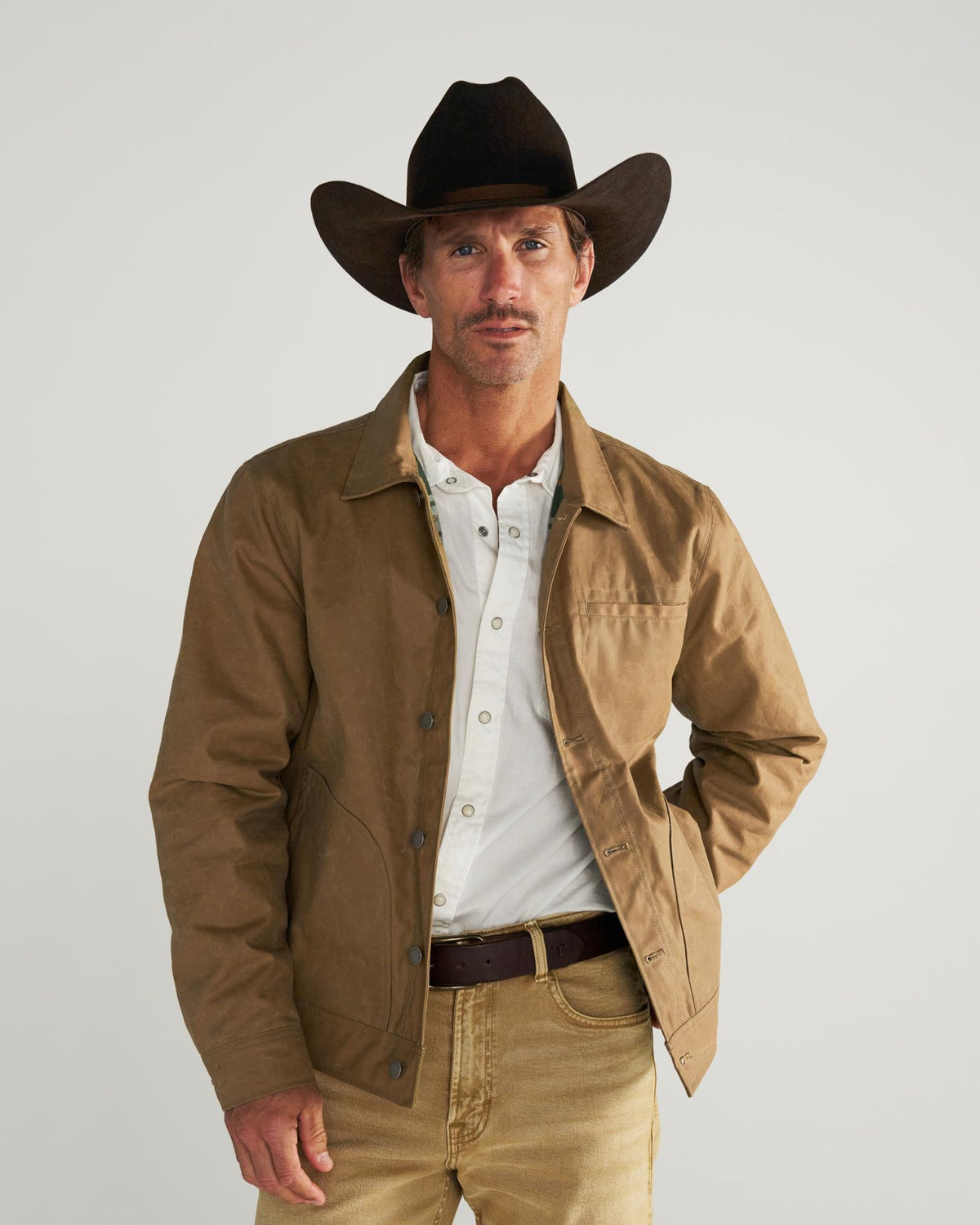 Front view of Men's Waxed Ranch Jacket - Field Tan on model