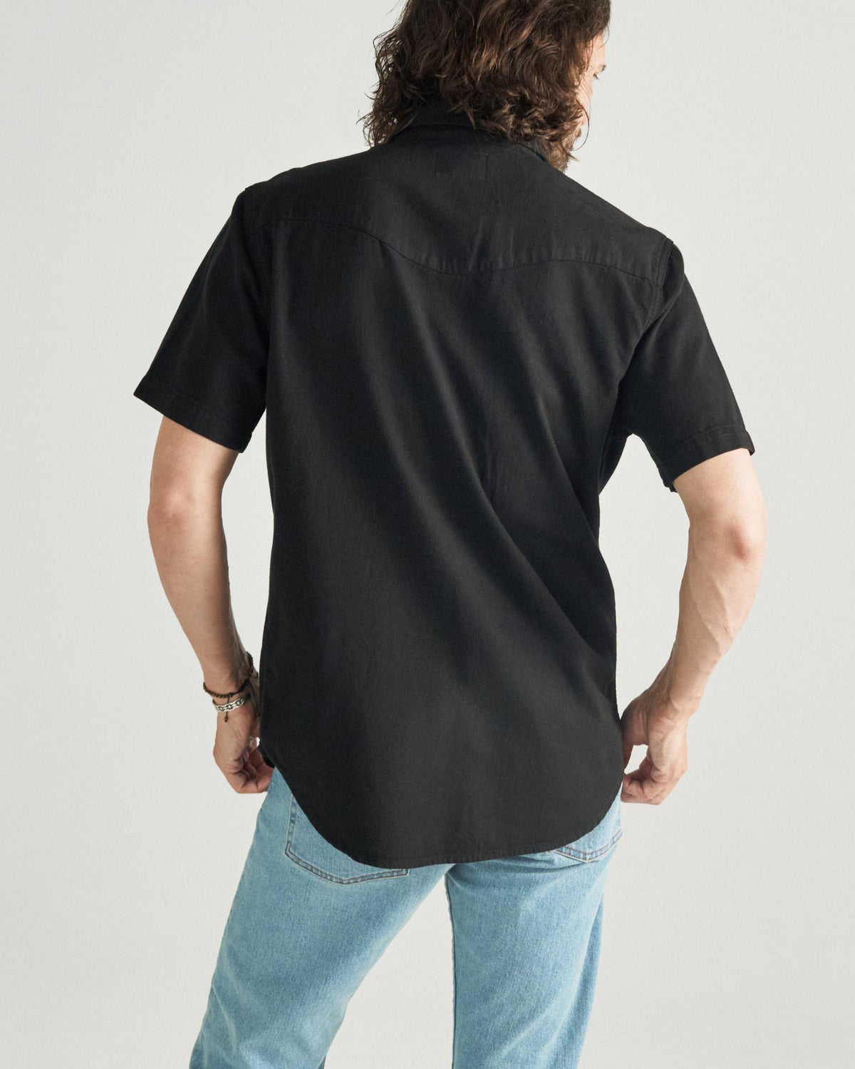 Closeup detail view of Men's Denim Pearl Snap SS - Black