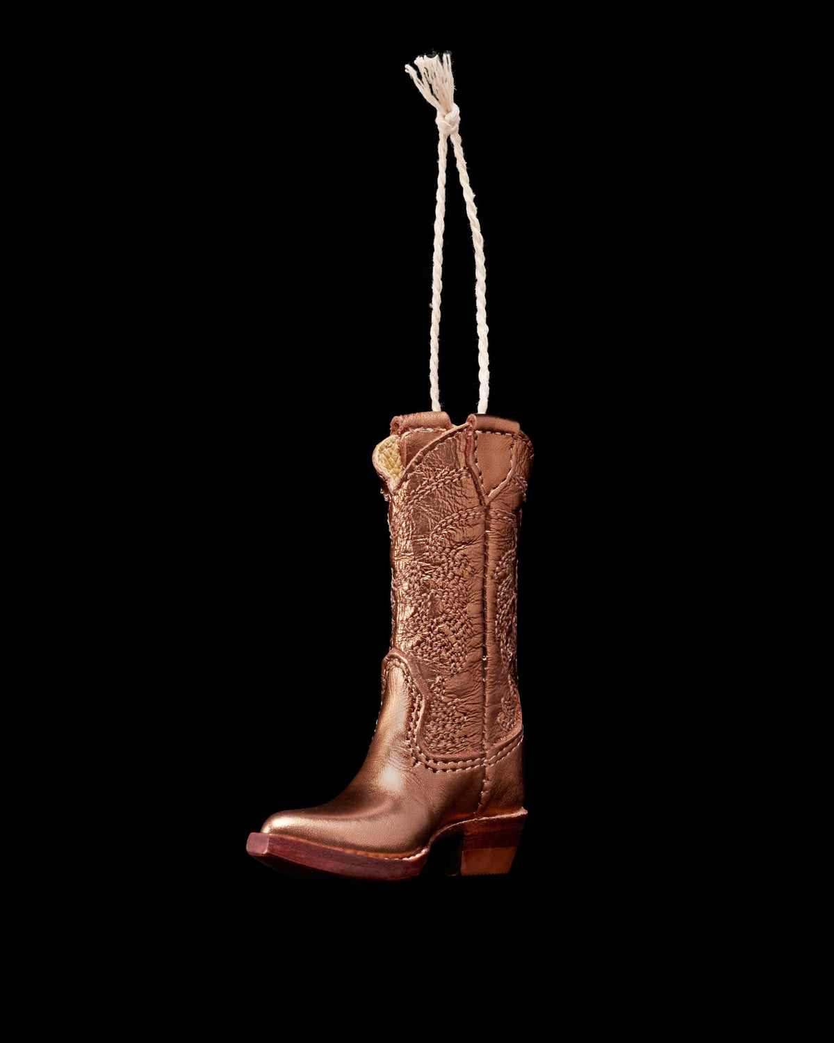 Quarterfront view of Annie Boot Ornament - Copper on plain background
